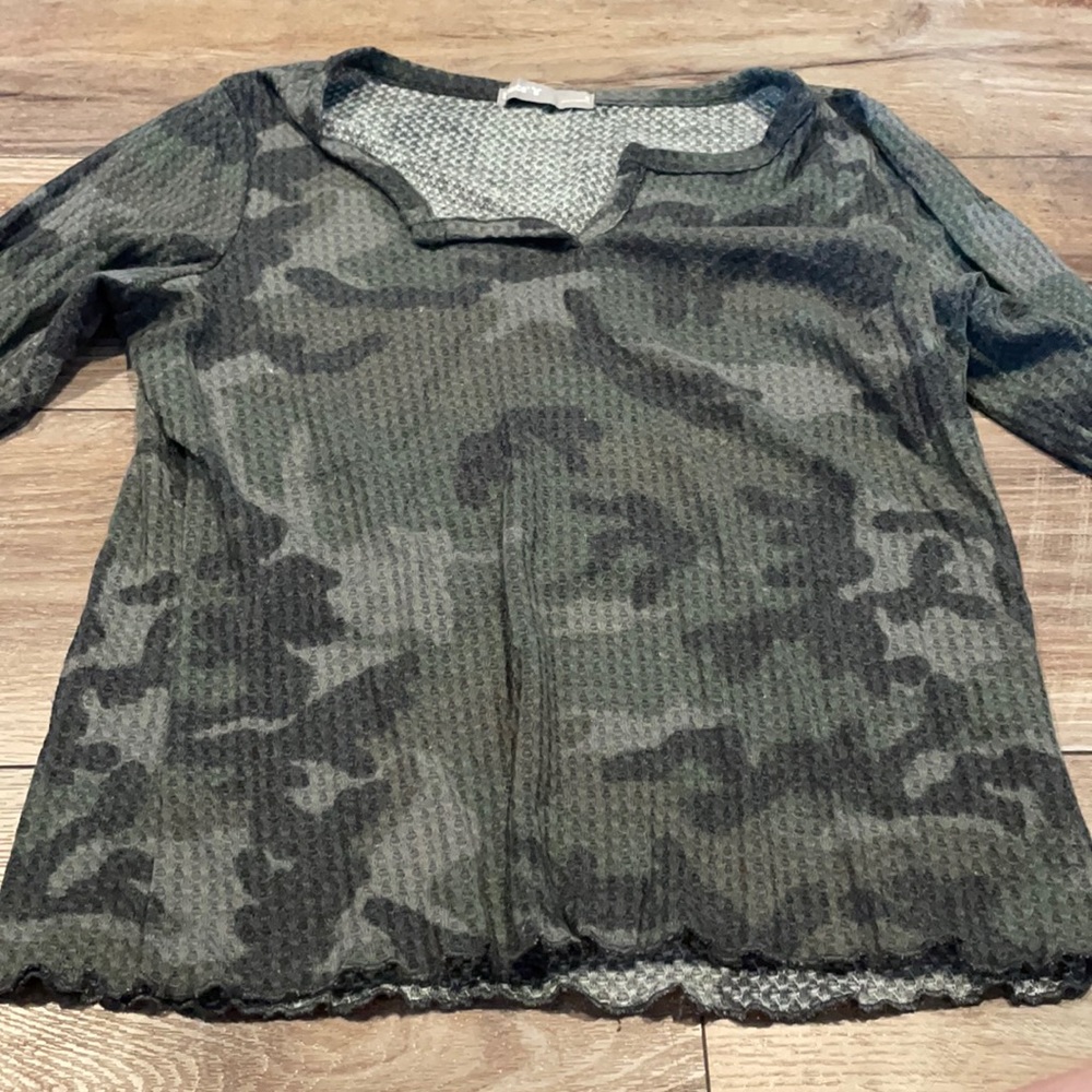 Long sleeved camouflage shirt.